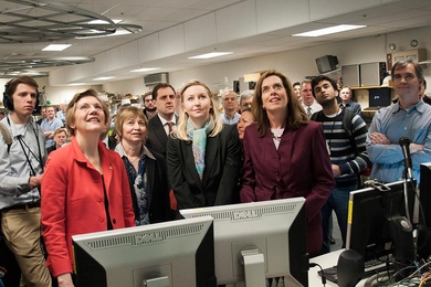 Listening to the countdown and watching a screen of the tokamak's interior, (from left) Warren, MIT Vice President for Research Maria Zuber, Livingstone (back), nuclear science and engineering assistant professor Anne White, Clark, and research scientist Jerry Hughes (far right), along with press and staff, await the the 'shot' that will create the plasma in Alcator C-Mod.