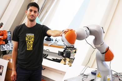 PhD student Lucas Manuelli worked with lead author Pete Florence to develop a system that uses advanced computer vision to enable a Kuka robot to pick up virtually any object.