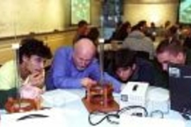 Professor of Physics John W. Belcher (second from left) surveys an experiment in the new interactive TEAL classroom being done by (left to right) freshman Bernardo Zacka, mechanical engineering sophomore Matthew Socks and mathematics sophomore John Gonzalez.