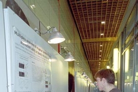 John Albeck, a graduate student in cellular biology, and Suzanne Gaudet,        a postdoctoral fellow in biology, prepared for the poster competition at        the symposium held in honor of MIT's new BioMicro Center (see MIT        Tech Talk, Jan. 9 ). The Jan. 11 symposium, "Computational and Systems Biology: From Biofabrication to Bioinformatics," was the first of what will become an annual eve...