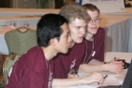 The MIT programming team works on a problem at the world finals of the ACM computer programming contest in Honolulu last month. Left to right: Sophomore Percy Liang, freshman Reid Barton and sophomore John Danaher came in second place, the best MIT finish in more than two decades.