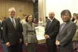 President Charles M. Vest, Barbara Picower, Jeffry Picower and Professor Susumu Tonegawa at last week's announcement of the Picower Foundation's gift of $50 million to establish the Picower Center for Learning and Memory at MIT. An architect's early design model for the new center can be seen on the table behind them.