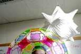 Erik Demaine, an assistant professor of EECS, shows off some of his origami and other creations.