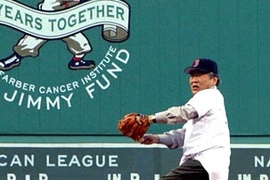 Professor Susumu Tonegawa winds up to throw the ceremonial first pitch at Fenway Park.