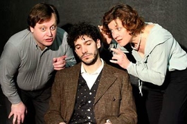 A sleeping Einstein (Robert Najarian) listens to the whispers of  dreamtellers (Debra Wise &amp; Steven Barkhimer) in the production of "Einstein's Dreams," produced by the  Catalyst Collaborative at MIT.