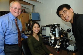 Professor Harry Tuller, left, leads a team that has found a way to print useful devices, like gas sensors, from inkjet printers. At far right is Woochul Jung, graduate student in material sciences and engineering, and at center is Amy Leung, a sophomore in chemical engineering; between them is the printing device.