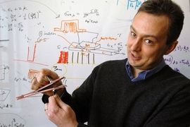Brian Wardle, the Charles Stark Draper Assistant Professor in the Department of Aeronautics and Astronautics, shows an advanced composite material held together by "nanostitching," a technique developed at MIT thatÂ could make airplane skins and other products stronger.