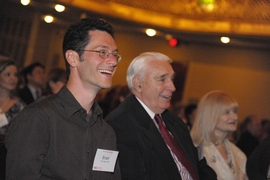 Eran Egozy ’95, MNG ’95, co-founder of Harmonix, and retiring MIT Corporation Chair Dana Mead PhD ’67 and his wife Nancy enjoy the 113th Tech Night at the Pops, which featured a Beatles sing-along via Harmonix’s Rock Band video game.