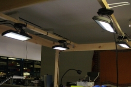 Visiting student Nan Zhao works in the test setup at the Media Lab under four LED fixtures controlled by the prototype adaptive system.