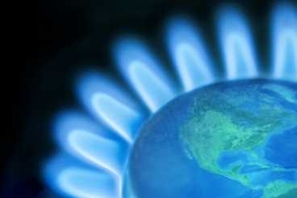 Photo illustration of a stovetop gas burner with an image of the world at the center