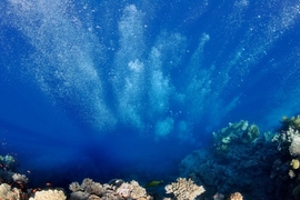 Aerial image of vast blue ocean with reef
