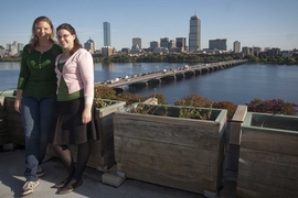 Graduate Resident Tutors Melinda Hale and Bridget Wall bask in the early autumn sun in their McCormick Hall garden. The East Penthouse rooftop was once abandoned, but the pair has transformed the Boston-facing patio into an urban oasis.