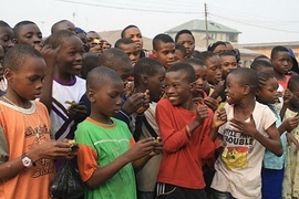 During the month of January, Bilikiss Adebiyi MBA '12 traveled to Nigeria to conduct market research and organize two recycling demo days in the community. Here, residents of Ajegunle, Lagos, exchanged recyclables for raffle tickets and anxiously await the calling of the winners.