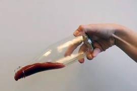 Ketchup slides out of a bottle that has the food-based, nontoxic LiquiGlide coating on the inside.