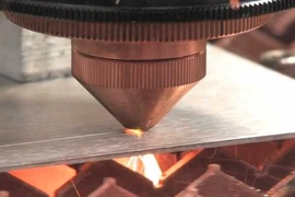The wavelength beam-combining diode laser is shown cutting through several millimeters of steel. A small spot size combined with high intensity provides high-speed cuts through thick materials with minimal impairment to the width of the cut. 