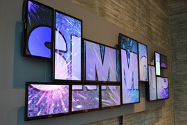 The newest piece of Simmons artwork will continue to hang in the dining hall. It is made of 12 Samsung LED displays constructed to represent the building's iconic shape.