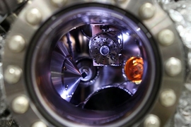 A solid-state lithium-air battery (highlighted in orange) is positioned inside a test chamber at the Advanced Light Source (ALS) at Lawrence Berkeley National Laboratory, in preparation for its testing using X-ray photoelectron microscopy.