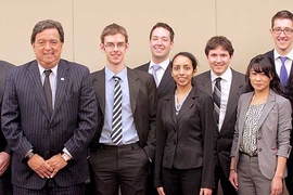 Energy Conference keynote speaker Bill Richardson, third from left, and MIT President L. Rafael Reif, right, pose with student organizers of the conference, including managing director Daniel Connell, second from left.
