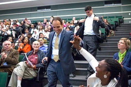 David Young of Bounce Imaging got a high-five from an audience member after he and co-founder Francisco Aguilar (behind) were announced as recipients of the $5,000 prize.