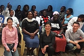 LGO student Erna Pardede (center) and her teammates Cinthya Avalos  (left) and Zachary Cohen (right) posed with the SHOFCO clinic staff in Nairobi, Kenya.
