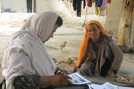 A woman in rural Afghanistan answers questions about the effects of the country's National Solidarity Program.
