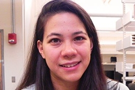 MIT doctoral student Sunny Wicks holds samples of carbon nanotube-strengthened cloth. 