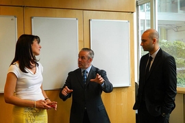 Massachusetts Secretary of Education Matthew Malone (center) speaks with Natalie Kuldell (left) — instructor in the Department of Biological Engineering and founder of BioBuilder — and Ryan Mudawar of Massachusetts Life Sciences Center.