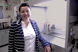 Associate Professor Silvija Gradečak with a metal organic chemical vapor deposition system used to create nanowires from metal seed particles. 