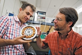 Mohammad Imani-Nejad PhD ’13 of the Laboratory for Manufacturing and Productivity (left) and David L. Trumper of mechanical engineering are building compact, durable motors that can operate at high speeds, making devices such as compressors and machine tools more efficient and serving as inexpensive, reliable energy storage systems.