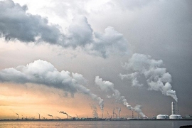 plumes from power plants against the sky