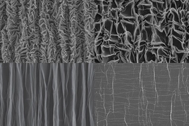 Four grayscale electron microscope images of graphene. Top right, graphene in a partially crumpled state. Bottom right, a piece that has been crumpled and then flattened out. Top left: chaotic crumpled pattern. Bottom left: graphene folded into pleats.