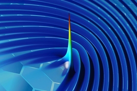 By using plasmons to “wiggle” a free electron in a sheet of graphene, researchers have developed a new method for generating X-rays. In this image of one of their simulations, the color and height represent the intensity of radiation (with blue the lowest intensity and red the highest), at a moment in time just after an electron (grey sphere) moving close to the surface generates a pulse.