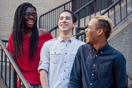 Founding planners of RAK Week, Bettina Arkhurst and Cory Johnson (left and far right), with volunteer graphic designer Daniel Sanchez (center). 
