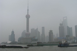 Coal barges head upstream on the Huangpu River in Shanghai. 