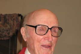 Robert Smith ’41, in his signature MIT red jacket, celebrates his 90th birthday.