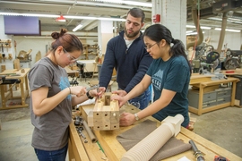 "We got to learn how to use saws, a drill press, and other machines," says Kathryn Hendrickson, rising senior and computer science major (at left with Theodore Mouratidis and Lauren Huang). "It was cool to make something physical, where I'm used to just code. Building a printing press is awesome."
