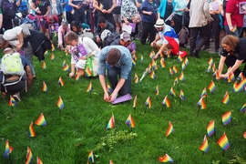 Community members planted pride flags to commemorate those killed at the Pulse night club in Orlando, Florida.