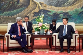 Zhang Gaoli (seated, right), vice premier of China, whose portfolio includes environmental issues, speaks with U.S. Secretary of State John Kerry at the outset of a meeting about climate change and other topics at the Great Hall of the People in Beijing, China, on Nov. 11, 2014. 