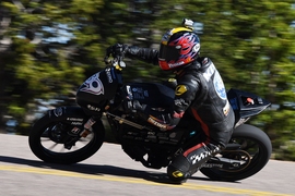 Professional rider and founder of Mirai EV of Japan Yosihiro Kishimoto rides the electric bike designed by the KOMMIT Electric Vehicle Team.