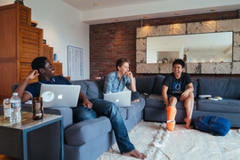 MIT seniors (left to right) Mohamed “Hassan” Kane, Guillermo Webster, and Kevin Kwok work on their startup projects at the “Sandcastle” in San Francisco. 
