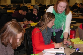 Dawn Wendell, senior lecturer in mechanical engineering, helps a student during the motor debugging class in 6.A01 (Mens et Manus: Building on the Science Core). 