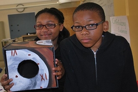 JV InvenTeam students proudly show their Super Lens invention activity. 