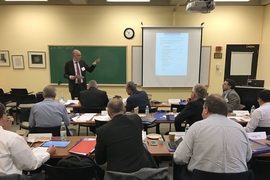 Martin Schneider, chief executive of the German Cement Works Association and head of the Verein Deutscher Zementwerke e.V. (VDZ) Research Institute, presents during a meeting that brought leaders of cement and concrete industry organizations together at MIT.  