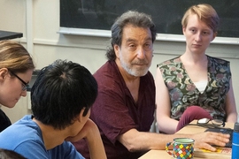 Lee Perlman (in maroon shirt) lectures on the philosophy of love at MIT. Perlman also teaches classes at Massachusetts prisons with a mix of both MIT students and prison inmates.