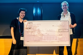 Roots Studio team members Rebecca Hui (left) and Macauley Kenney recieve the top prize in the 2017 Creative Arts Competition.