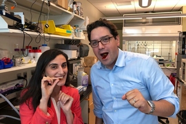 A new flexible piezoelectric sensor is 2 by 2.5 centimeters and can be rolled up and swallowed.  “For the first time, we showed that a flexible, piezoelectric device can stay in the stomach up to two days without any electrical or mechanical degradation,” assistant professor Canan Dagdeviren, left, says. Dagdeviren is next to researcher Giovanni Traverso. 
