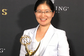 Vivienne Sze, who was part of a team that developed a new video-compression standard, holds an Engineering Emmy Award recognizing the group's work. 