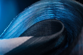 Unique fabrics woven with microstructured polymer fibers and containing microelectronics will be transitioned into integrated systems at the Defense Fabric Discovery Center at Lincoln Laboratory.