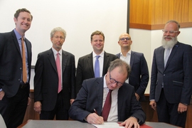 Standing, left to right: Justin Leahey, MIT-Germany program manager; David Dolev, MISTI assistant director; Markus Buehler, MIT-Germany faculty director, professor, and head of the Department of Civil and Environmental Engineering; Ulrich Steinbach, deputy minister of the Baden-Wuerttemberg Ministry of Science, Research, and the Arts; Wolfgang Holtkamp, senior advisor if international affairs at t...