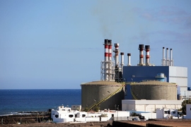 Seaside desalination plants like this typically discharge large volumes of concentrated brine back into the sea. MIT researchers have shown that instead, much of this waste could be turned into useful chemicals.